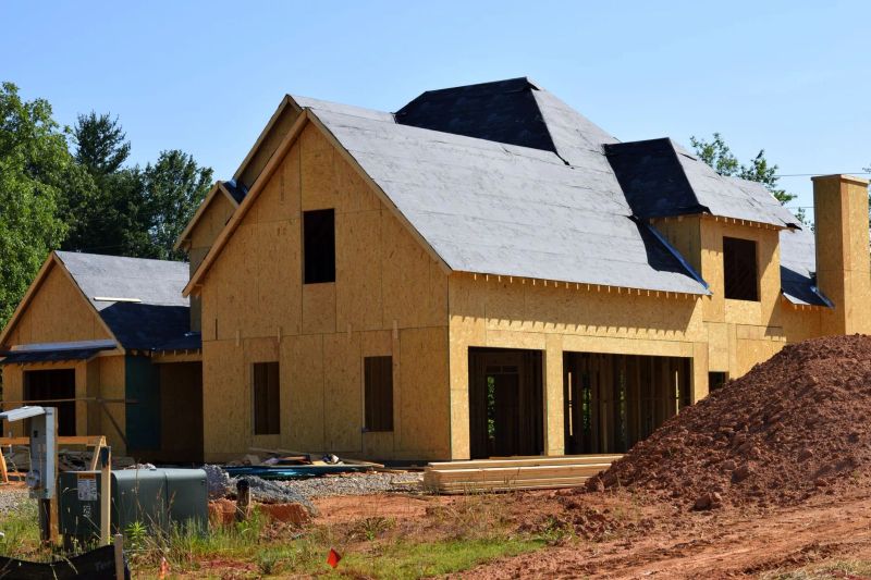 Installation team applying James Hardie fiber cement siding